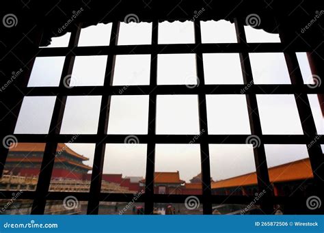 Silhouette of Metal Muntin Bars with a Gloomy Sky and a Building Behind ...