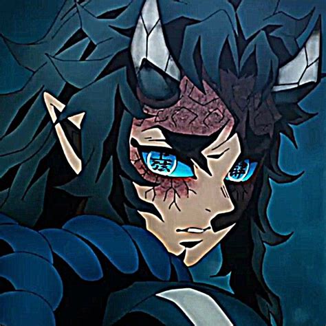 an anime character with blue eyes and horns