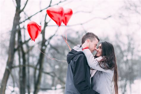 Two People With Heart Shape Balloons in Winter · Free Stock Photo