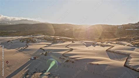 Revealing drone footage of the beautiful beach at sunrise Stock Video | Adobe Stock