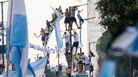 Argentina parties after World Cup win as fans ride horses and hang from lampposts