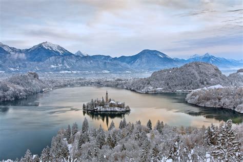 Photo Gallery: Lake Bled draped in winter white in the winter