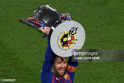 Barcelona's Argentinian forward Lionel Messi raises La Liga trophy as ...