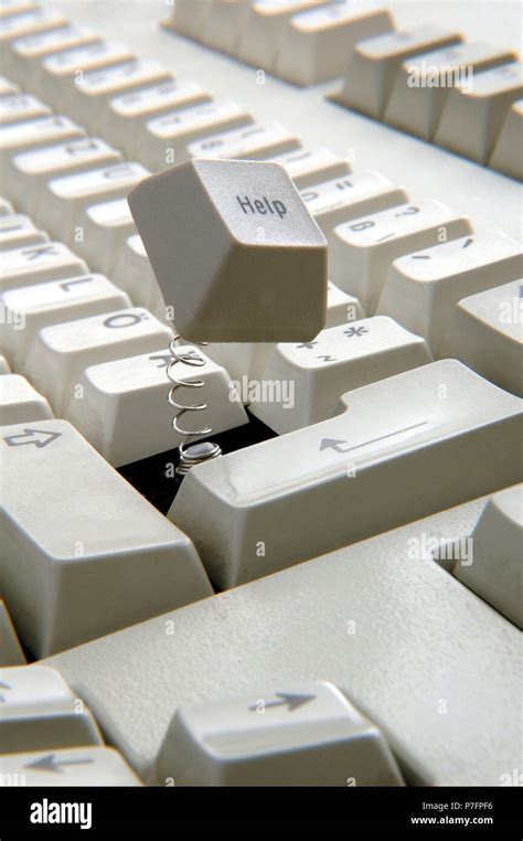 Help key jumps out of the keyboard Stock Photo - Alamy