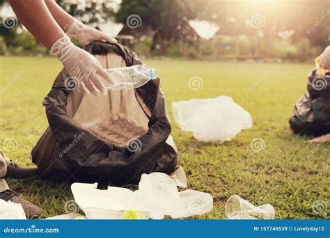 Close Up Hand Picking Up Garbage Plastic for Cleaning at Park Stock ...