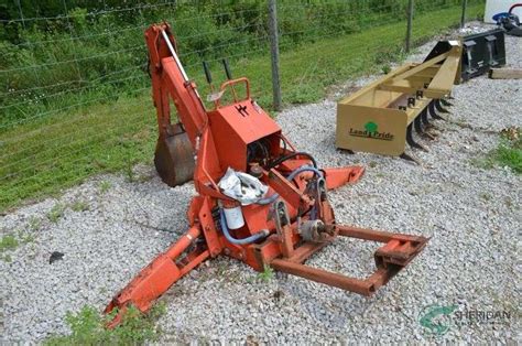 backhoe attachment - Sheridan Realty & Auction Co.