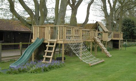 diy outdoor fort with slide | Bespoke designed play structure built round trees | Backyard ...