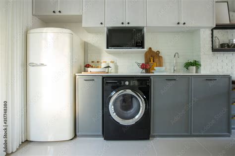 Modern white kitchen, gas stove with electric oven, fridge, clean ...