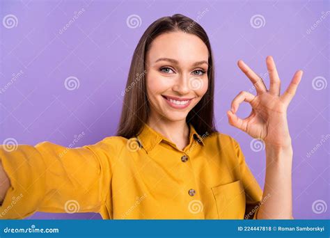 Photo Portrait of Smiling Woman Showing Okay Sign in Yellow Shirt Smiling Taking Selfie Isolated ...