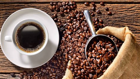 cup-of-coffee-and-roasted-beans-on-wood-table-uhd-4k-wallpaper - Svastha Ayurveda