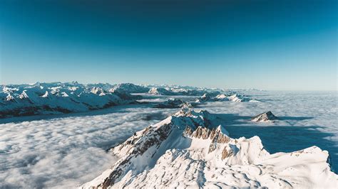 Aerial photography of mountain covered by snow, snow, mountains, clouds HD wallpaper | Wallpaper ...