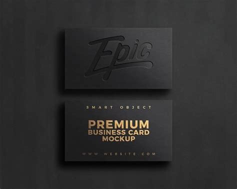 two black business cards with gold foil lettering