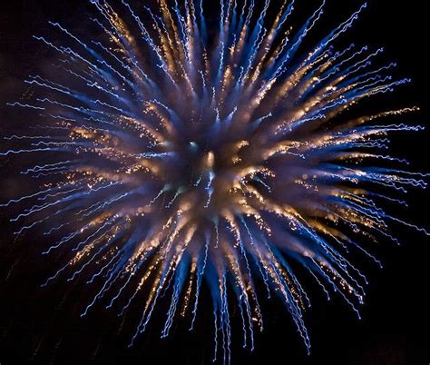 colorful fireworks in the dark sky with no clouds or people around them ...