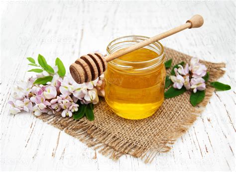 honey with acacia blossoms 6049689 Stock Photo at Vecteezy