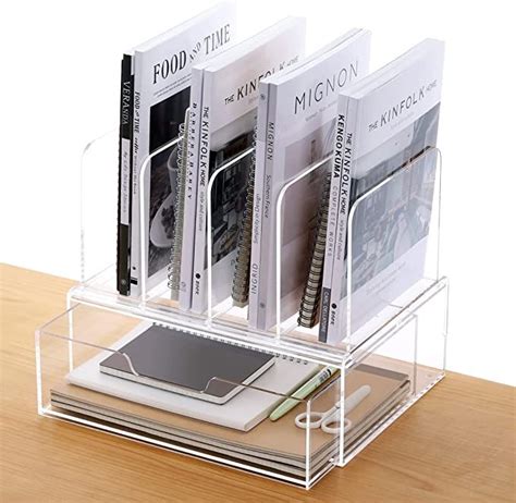 a stack of books sitting on top of a wooden table