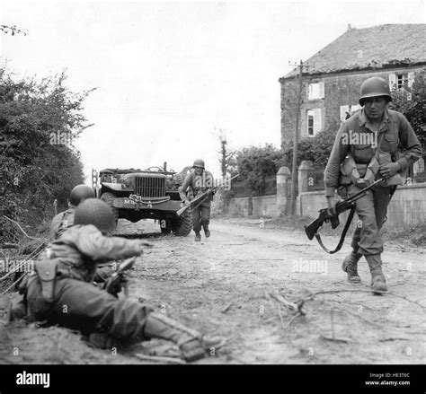 Normandy, France, June 1944. Allied soldiers fighting in the countryside and in the villages of ...