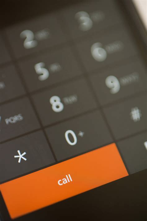 Free Stock Photo 10816 Orange Call Dial Button on a Touch Screen Phone | freeimageslive