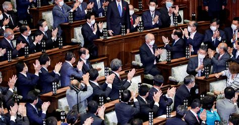 Japan's new PM calls Oct. 31 election, vows to fight pandemic | Reuters