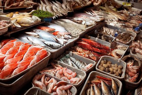 Premium Photo | Seafood delicacies laid out in bowls on counter at fish ...