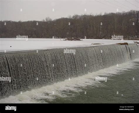 Water flows over the Embrey Dam in February before its demolition ...