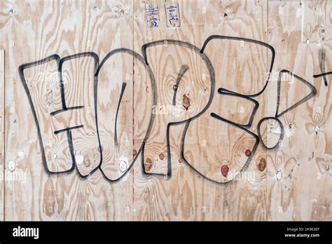 Hope graffiti spray painted on wooden boards, UK Stock Photo - Alamy