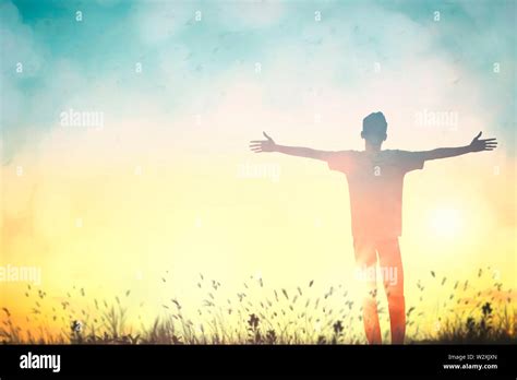 Happy man rise hand on morning view. Christian inspire praise God on good friday background ...