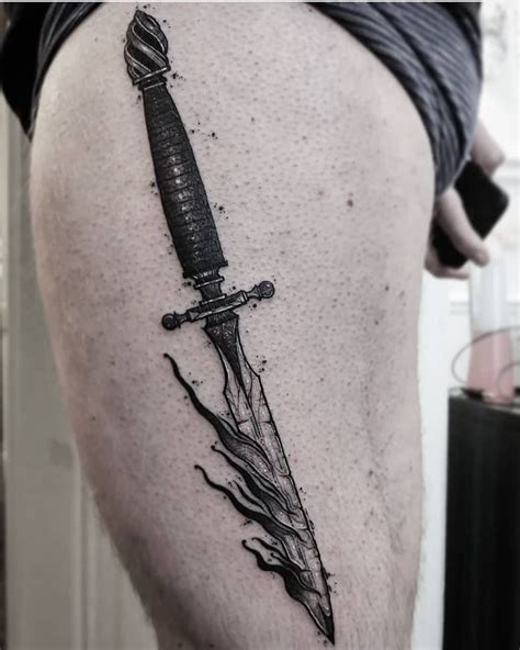 Burning dagger tattoo inked on the left thigh | Thigh tattoos women, Dagger tattoo, Ink tattoo