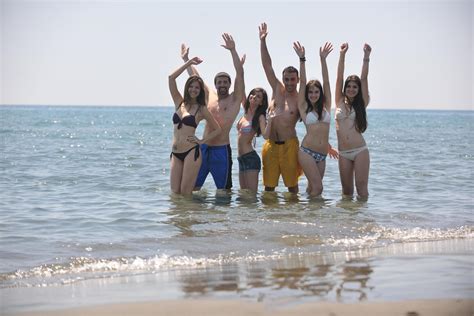 happy people group have fun and running on beach 12643068 Stock Photo at Vecteezy