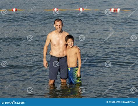 Father And Son Enjoying The Lake In Greenlake Park, Seattle, Washington ...