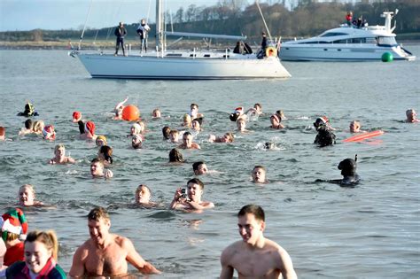 Boxing Day swim sees young and old plunge into the icy sea for charity ...