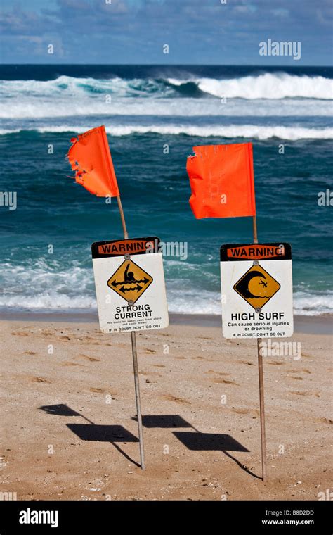 Surf warning flags on the beach in Maui, Hawaii Stock Photo - Alamy