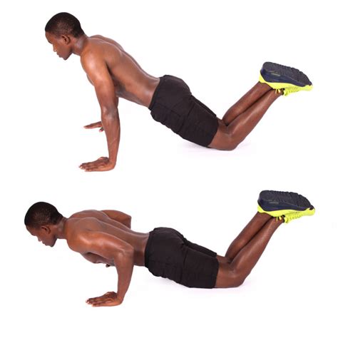 Shirtless Muscular Man Demonstrates How To Perform Knee Push Ups - High Quality Free Stock Images