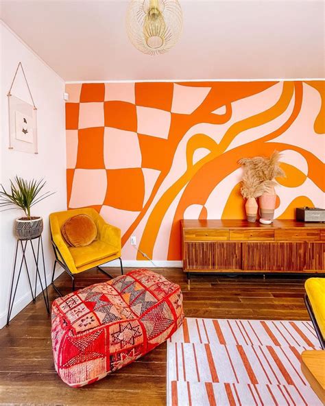 a living room with orange and white walls