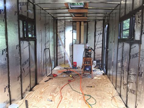 the inside of a house being built with wood flooring and construction materials on the walls