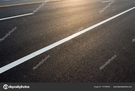 Road markings on asphalt Stock Photo by ©releon8211 170189354