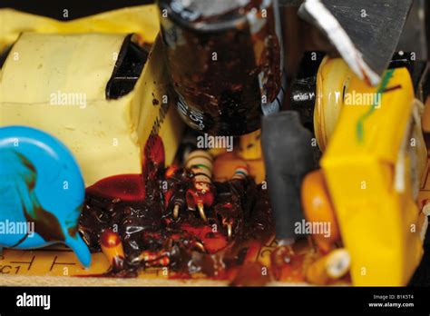 Damaged circuit board with leaking capacitor Stock Photo - Alamy