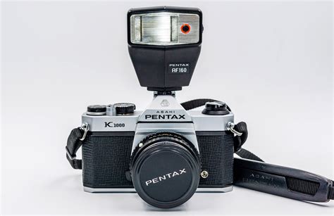 Iconic PENTAX K1000 Film Camera with SMC Pentax-M 50mm f1.7 lens, Pentax Flash, Leather Case ...