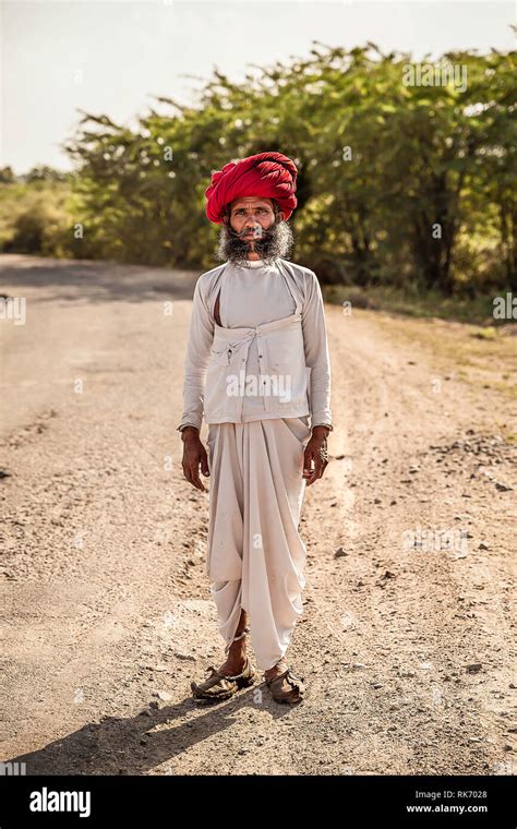 Rajasthani man wearing white traditional dress and red turban Stock Photo - Alamy