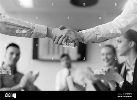 Business womans handshake Stock Photo - Alamy