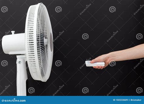 White Electric Fan Turns on, Turns Off with the Remote Control. Hand Hold Electric Fan Remote ...