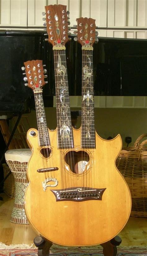 Triple Neck made for John Paul Jones by British Luthier Andy Manson. It has a mandolin, 12 ...