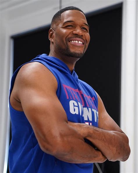 GMA’s Michael Strahan is ‘all smiles’ as he flexes his muscles in ...