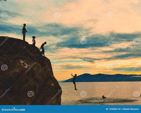 Cliff Diving at Kande Beach, Nkhata Bay, Lake Malawi, Malawi Stock Photo - Image of sunset ...