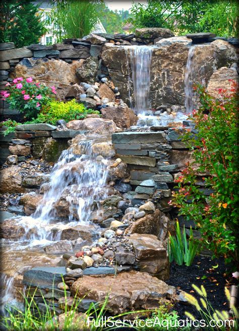 Multi-tier 9' high waterfall with pooling areas designed and installed ...