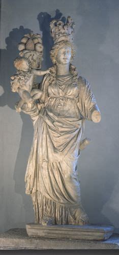 an image of a statue with flowers in her hand