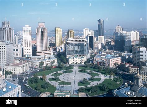 China, Liaoning, Dalian, Zhongshan Guangchang (Zhongshan Square), lawns encircled by ring of ...