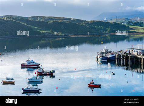 PORTREE, ISLE OF SKY, SCOTLAND - SEPTEMBER 16, 2021: View of Portree harbour. Portree is the ...