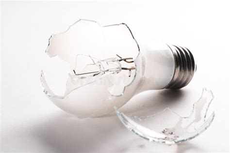 Broken Light Bulb Isolated on White Background with Shattered Piece of ...