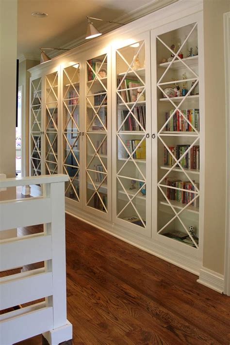 27 Beautiful Book Storage Ideas | Bookcase with glass doors, Family room design, Contemporary ...