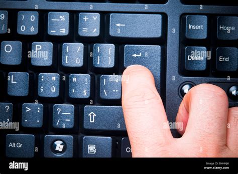 pressing a keyboard enter key Stock Photo - Alamy